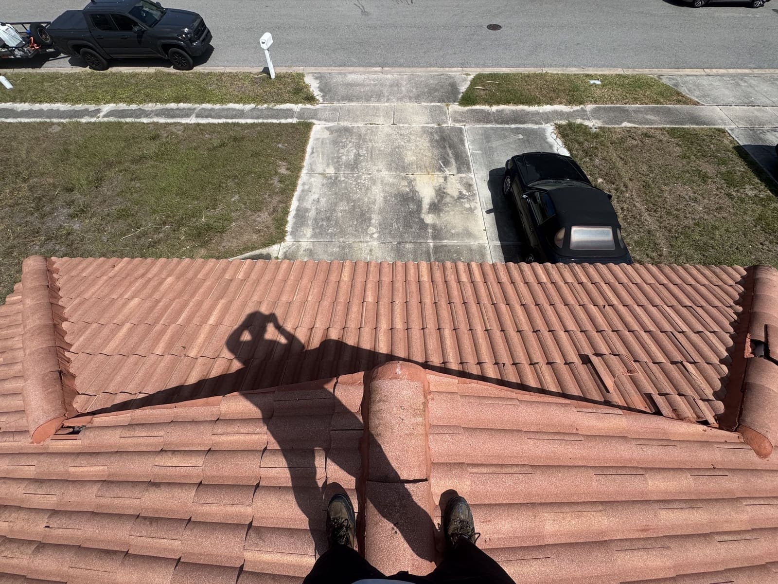 The same terracotta tile roof after soft washing, clean and even