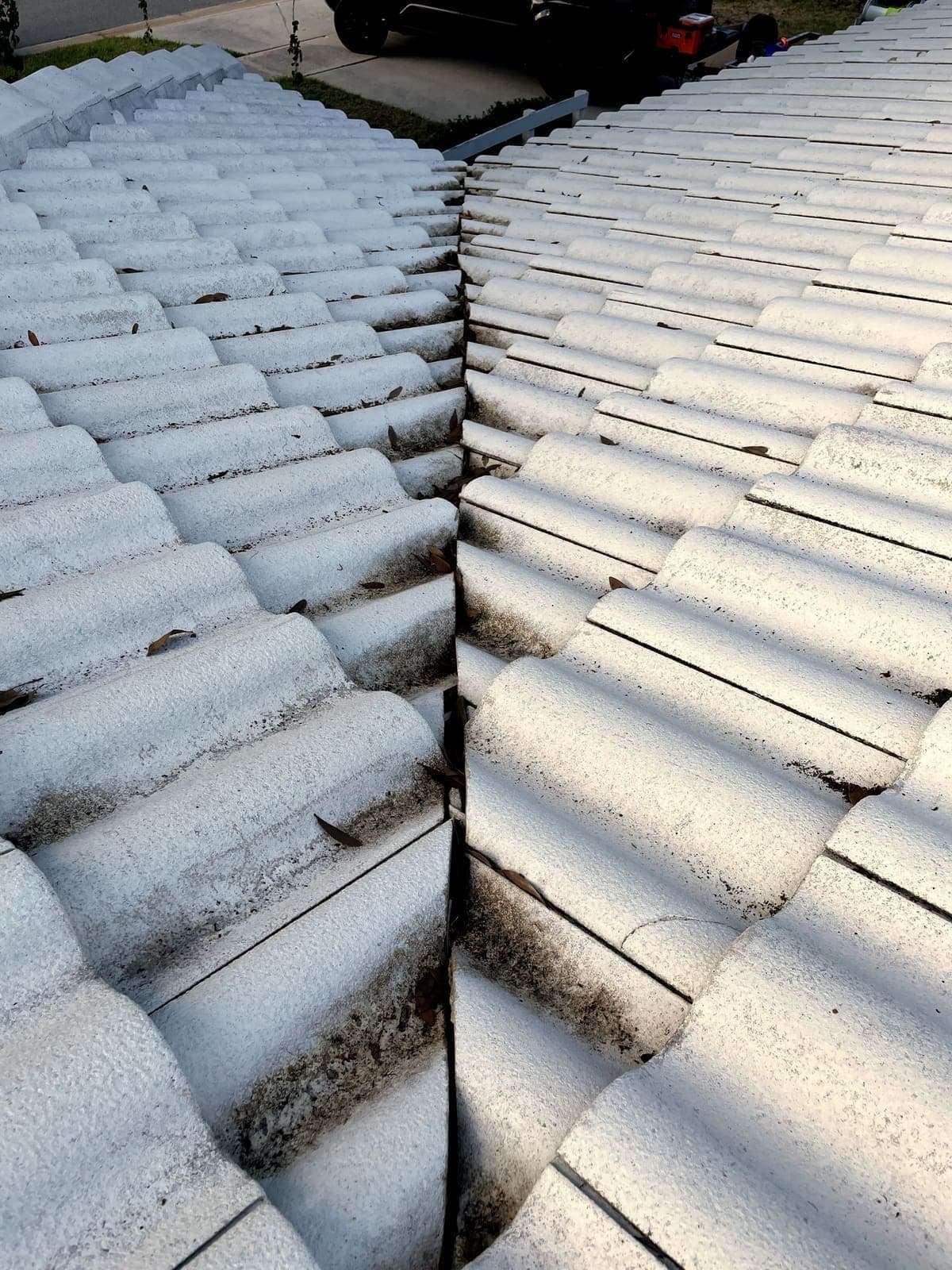 Florida tile roof before cleaning, covered in dirt and algae streaks